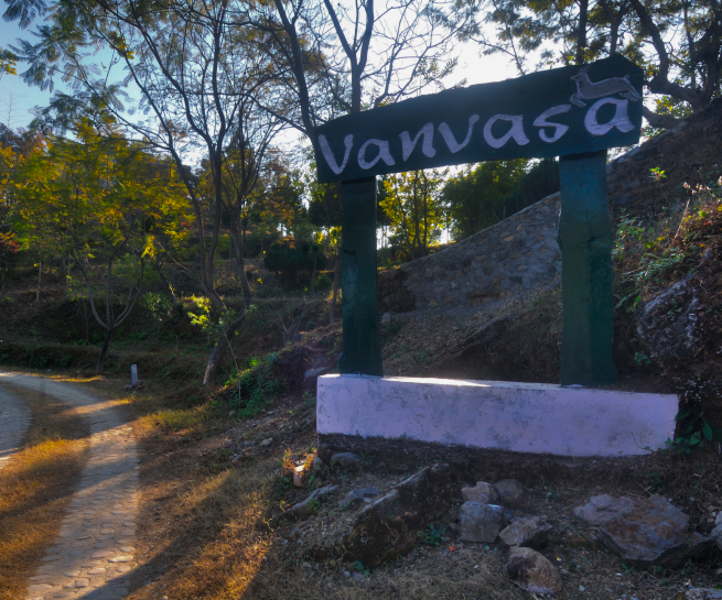gate symbol green colour with pathway of vanvasa resort enrance